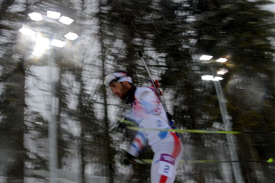 France's Martin Fourcade competes to win silver in the Men's Biathlon 15 km Mass Start at the Laura Cross-Country Ski and Biathlon Center during the Sochi Winter Olympics on February 18, 2014, in Rosa Khutor, near Sochi. AFP PHOTO / KIRILL KUDRYAVTSEV