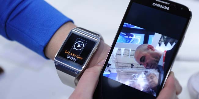 The Samsung Gear smartwatch is presented at the Mobile World Congress in Barcelona, on February 24, 2014.  The Mobile World Congress runs from the 24 to 27 February where participants and visitors alike can attend conferences, network, discover cutting-edge products and technologies at among the 1,700 exhibitors as well as seek industry opportunities and make deals.   AFP PHOTO / JOSEP LAGO