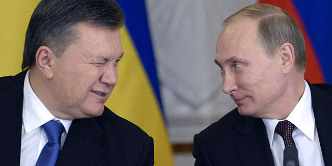 (FILES) -- A file photo taken on December 17, 2013 shows Ukrainian President Viktor Yanukovych winking at his Russian counterpart Vladimir Putin during a signing ceremony at the Kremlin in Moscow. Yanukovych has left Kiev, opposition leader Vitali Klitschko said on February 22, 2014, amid reports that the president has fled the country altogether following a week of deadly violence. 