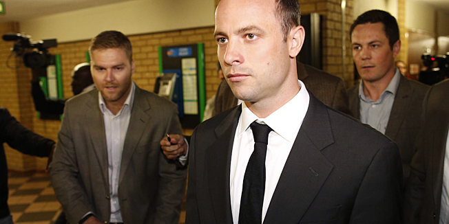 CORRECTION: DATESouth African amputee Olympian sprinter Oscar Pistorius (C) arrives at Pretoria's North Gauteng High Court on March 3, 2014, for the opening day of his murder trial, accused of murdering his girlfriend. Pistorius, 27, arrived to appear in court and on television screens around the world to answer charges that he wilfully shot his gilfriend Reeva Steenkamp dead on Valentine's Day 2013 through a locked bathroom door at his home in the city, and faces a life sentence if convicted. AFP PHOTO / MARCO LONGARI