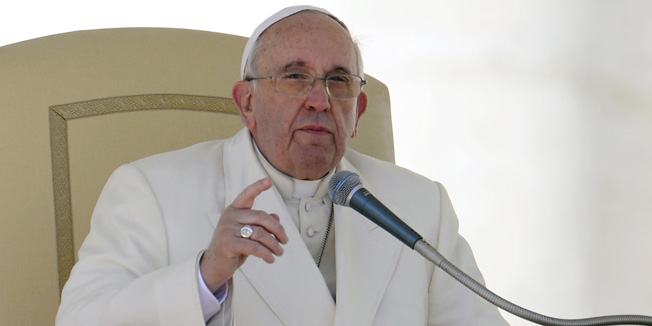 Pope Francis gestures in St.Peter's square at Vatican during his weekly general audience on March 5, 2014.  Pope Francis has defended the Catholic Church's record on tackling the sexual abuse of children by priests, saying 