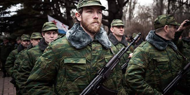 Some 100 soldiers fo the newly formed Crimean army attend the oath ceremony in Simferopol on March 8, 2014. A dangerous escalation in the flashpoint Black Sea peninsula of Crimea that Russia effectively seized from Ukraine last week saw 40 gunmen in balaclavas and military fatigues fire warning shots above a car moving in front of a convoy of 57 civilian and military observers from the Organisation of Security and Co-operation in Europe (OSCE). The culturally-splintered ex-Soviet nation of 46 million people has been in upheaval since three months of deadly unrest brought new pro-European leaders to power in Kiev in February and sent ousted president Viktor Yanukovych into hiding in Russia. AFP PHOTO/ RONNY ROMAN ROZENBERG    **GERMANY OUT -- NETHERLANDS OUT**