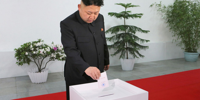 This photo dated March 9, 2014 and released by North Korea's official Korean Central News Agency (KCNA) on March 10 shows North Korean leader Kim Jong-Un casting his ballot in the election of a deputy to the Supreme People's Assembly at sub-constituency No. 43 of Constituency No. 105 together with service personnel of North Korean army at Kim Il Sung University of Politics.  AFP PHOTO / KCNA  REPUBLIC OF KOREA OUTTHIS PICTURE WAS MADE AVAILABLE BY A THIRD PARTY. AFP CAN NOT INDEPENDENTLY VERIFY THE AUTHENTICITY, LOCATION, DATE AND CONTENT OF THIS IMAGE. THIS PHOTO IS DISTRIBUTED EXACTLY AS RECEIVED BY AFP.---EDITORS NOTE--- RESTRICTED TO EDITORIAL USE - MANDATORY CREDIT 