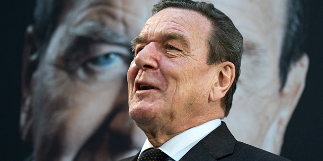 Former German Chancellor Gerhard Schroeder, poses as he presents his book 