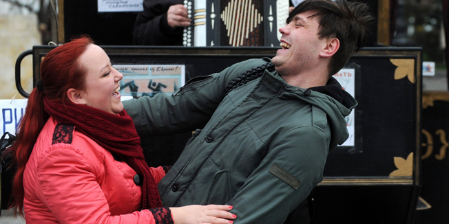 A man plays accordion as people dance during celebrations in Sevastopol on March 17, 2014. Crimea declared independence today and applied to join Russia while the Kremlin braced for sanctions after the flashpoint peninsula voted to leave Ukraine in a ballot that has fanned the worst East-West tensions since the Cold War. AFP PHOTO / VIKTOR DRACHEV