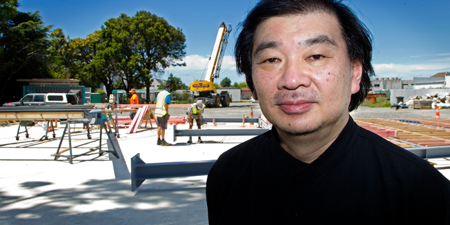 (FILES) This file photo taken on December 5, 2012 shows Japanese architect Shigeru Ban posing in front of the new Christchurch Cathedral building site which will be made of cardboard in Christchurch. Japanese architect Shigeru Ban, who uses cardboard tubes to make temporary housing for victims of natural disasters and refugees fleeing violence, has won his field's highest honour, the Pritzker Architecture Prize, it was announced on March 24, 2014.      AFP PHOTO / FILES / MARTY MELVILLE