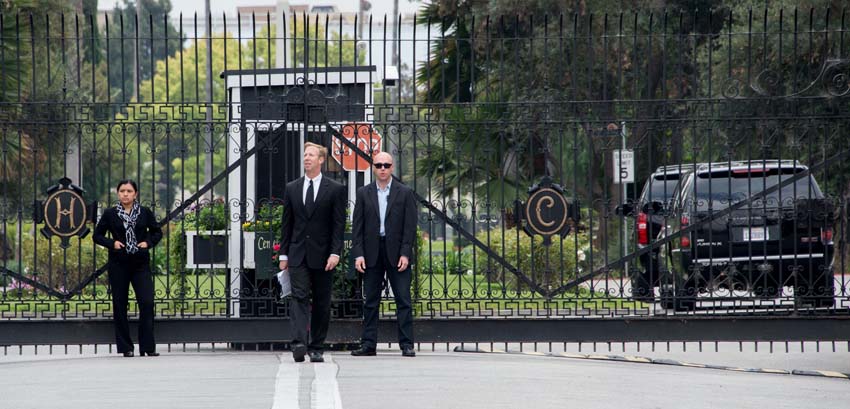 A security detail guards the main gate of Hollywood Forever Cemetery during during the funeral of Mick Jagger's girlfriend LWren Scott in Hollywood, California on March 25, 2014. The model-turned-fashion designer was found hanged in her luxury New York apartment last week. She was 49. The cemetery was closed for the roughly one-hour service, held amid tight security.   AFP PHOTO/JOE KLAMAR
