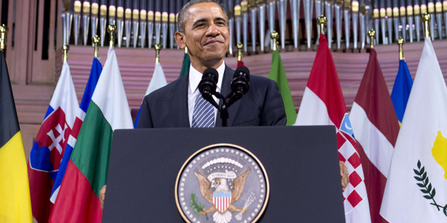US President Barack Obama smiles before delivering a speech at the Palais des Beaux-Arts (Palace of Fine Arts - BOZAR) in Brussels on March 26, 2014. Obama said Russia stood 