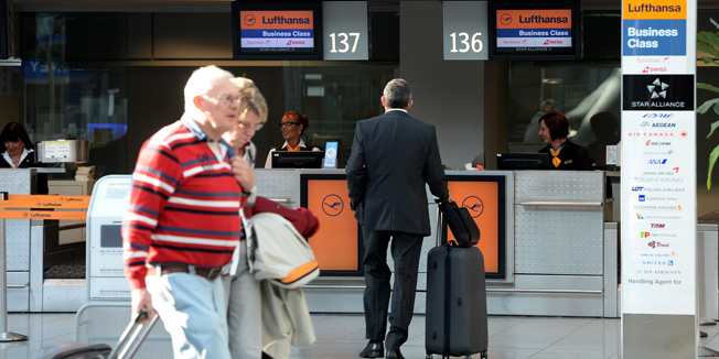 A counter of German airline Lufthansa is seen at Duesseldorf International airport on March 13, 2014 in Duesseldorf, western Germany. Germany's biggest airline, said that its bottom-line profit nosedived in 2013, but it will resume dividend payments to shareholders. AFP PHOTO / PATRIK STOLLARZ