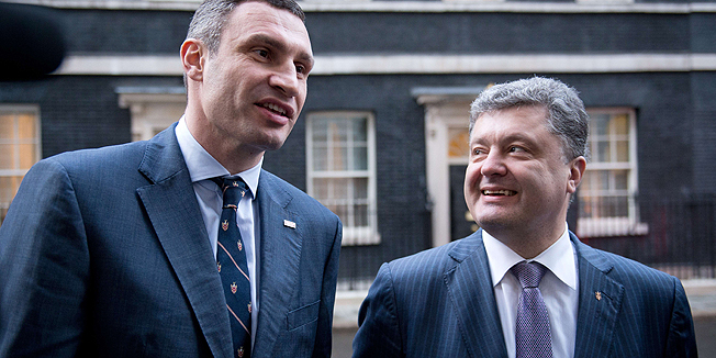 Leader of Ukrainian UDAR (Punch) political party Vitali Klitschko (L) and Ukranian MP Petro Poroshenko speak to the press outside 10 Downing Street following a meeting with British Prime Minister David Cameron in Central London on March 26, 2014. Cameron's spokesman said that the meeting in 10 Downing Street would be 