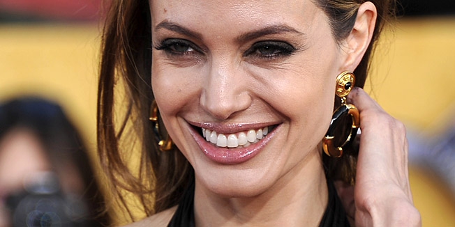 (FILES)Actress Angelina Jolie arrives to the 18th Annual Screen Actors Guild Awards at the Shrine Auditorium in Los Angeles, California in this January 29, 2012 photo. Angelina Jolie revealed May 14, 2013 that she has undergone a preventive double mastectomy to reduce her risk of cancer. The American actress wrote in an opinion piece entitled 