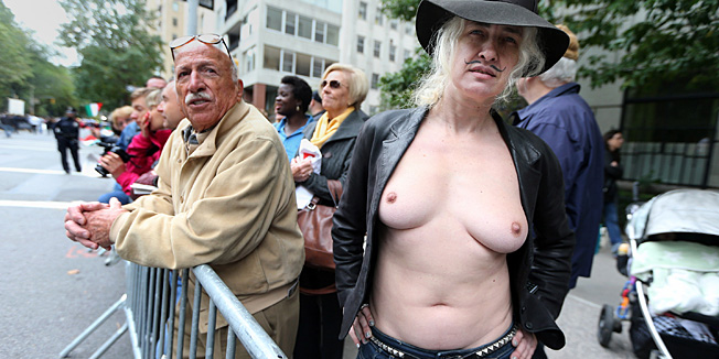 NEW YORK, NY - OCTOBER 08: (EDITORS NOTE: Image contains nudity.) Topless nudity activist Holly Van Voast poses during the annual Columbus Day Parade on October 8, 2012 in New York City. The Italian-American parade was launched in 1929 and is billed as the worldâs largest celebration of Italian-American heritage featuring more than 35,000 participants.   Mario Tama/Getty Images/AFP