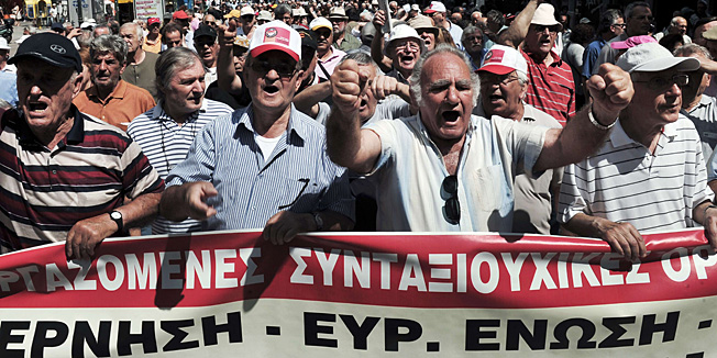 Hundreds of pensioners march in central Athens on June 6, 2013 to demonstrate against pension cuts and the failing social health system.  The International Monetary Fund admitted to significant failures in the first Greek rescue that forced a second, larger bailout and left the country in a deep recession.  AFP PHOTO/ LOUISA GOULIAMAKI