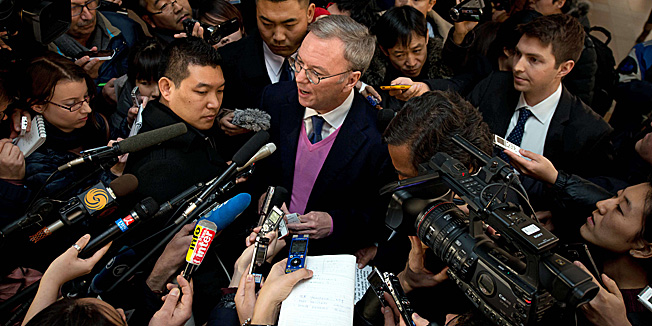 Google chairman Eric Schmidt (C) talks to the media after arriving at Beijing airport from North Korea on January 10, 2013 with former New Mexico governor Bill Richardson (not pictured).  Richardson and Schmidt met with reporters following their visit to secretive North Korea calling for greater Internet freedom for the welfare of its people.    AFP PHOTO / Ed Jones