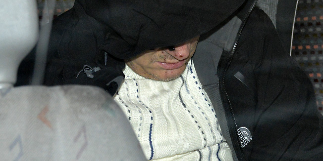 Zagreb, 140113.Vojislav Blazevic, osumnjiceni za postavljanje dviju bombi u Podsusedu, u pratnji policije napustio je bolnicu Sestara Milosrdnica u Vinogradskoj.Foto: Admir Buljubasic / CROPIX