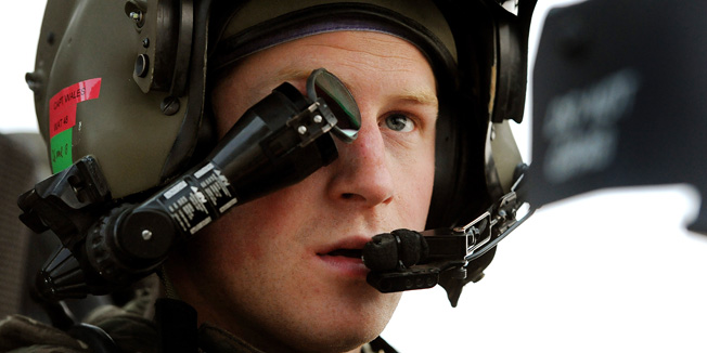 This picture taken on December 12, 2012 shows Britain's Prince Harry wearing his monocle gun sight as he sits in the front seat of his Apache Helicopter at the British controlled flight-line at Camp Bastion in Afghanistan's Helmand Province, where he was serving as an Apache Helicopter Pilot/Gunner with 662 Sqd Army Air Corps. Britain's Prince Harry confirmed he killed Taliban fighters during his stint as a helicopter gunner in Afghanistan, it can be reported after he completed his tour of duty on January 21, 2013.  AFP PHOTO / POOL / JOHN STILLWELL