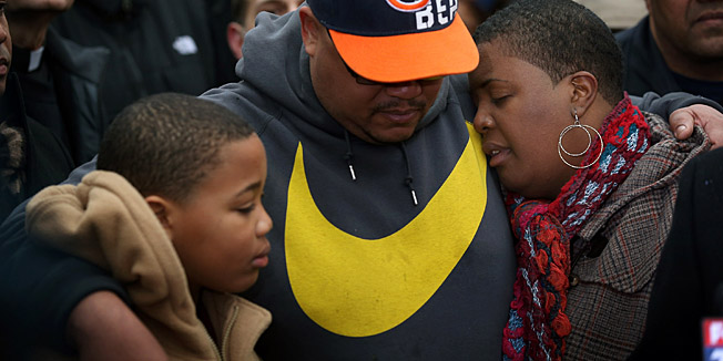 CHICAGO, IL - JANUARY 30: Nate Pendleton comforts his son Nathaniel, 10, and his wife Cleopatra as they listen to speakers at a press conference in a neighborhood park where Nate's daughter Hadiya was killed on January 30, 2013 in Chicago, Illinois. Fifteen-year-old Hadiya was shot and killed when a gunman opened fire in the park yesterday while she was hanging out with friends on the warm rainy afternoon under a shelter in the park. Hadiya was a majorette in her high school band and recently performed in Washington, D.C. during the inauguration. President Obama's Chicago home is less than a mile from the park where Hadiya was killed. Another person was wounded in the leg during the shooting.   Scott Olson/Getty Images/AFP== FOR NEWSPAPERS, INTERNET, TELCOS & TELEVISION USE ONLY ==