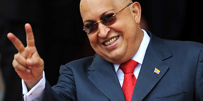 This file picture shows Venezuelan President Hugo Chavez making the 'v' sign after a meeting with Russian Foreign Minister Sergei Lavrov at the presidential palace in Caracas on August 24, 2011 during the latter's official visit to the country. Venezuelan President Hugo Chavez passed away on March 5, 2013 in Caracas after a long fight with cancer. AFP PHOTO/Juan BARRETO
