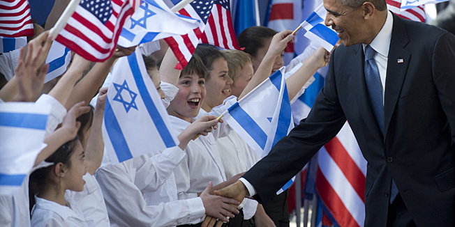 TOPSHOTSUS President Barack Obama greets Israeli children prior to meeting with Israeli President Shimon Peres at the President's Residence in Jerusalem, March 20, 2013, on the first day of Obama's three day trip to Israel. TOPSHOTS/AFP PHOTO / SAUL LOEB