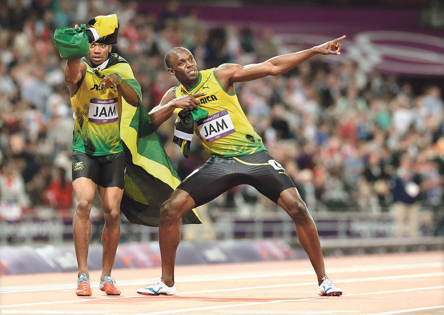 boltstr. 26., 5 stupacaJamaica's Usain Bolt, right, and Yohan Blake celebrate their win in the men's 4 x 100-meter relay during the athletics in the Olympic Stadium at the 2012 Summer Olympics, London, Saturday, Aug. 11, 2012. Jamaica set a new world record with a time of 36.84 seconds. (AP Photo/Anja Niedringhaus)