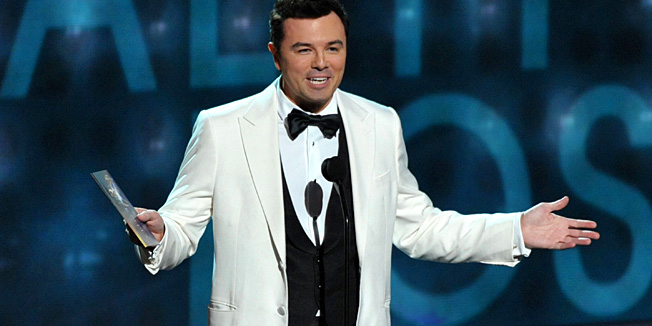 FILE - This Sept. 23, 2012 file photo shows Seth MacFarlane presenting an award at the 64th Primetime Emmy Awards at the Nokia Theatre in Los Angeles. Macfarlane will host the 85th Academy Awards on Sunday, Feb. 24, 2013 on the ABC Television Network. (Photo by John Shearer/Invision/AP, file)