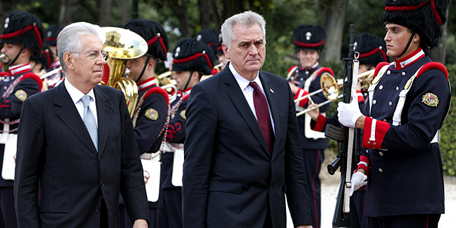 Italian Premier Mario Monti, left, and Serbian President Tomislav Nikolic review the honor guard during a meeting at Rome's Villa Pamphilj,  Tuesday, Oct. 9, 2012. (AP Photo/Andrew Medichini)