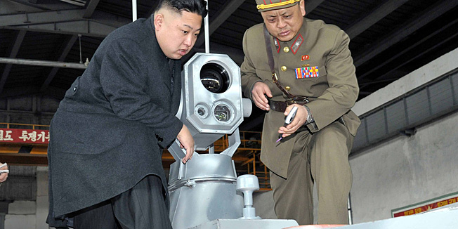 This photo taken on March 24, 2013 and released by North Korea's official Korean Central News Agency (KCNA) on March 25 shows North Korean leader Kim Jong Un (C) inspecting  the Korean People's Army Unit 1501 at an undisclosed location in North Korea. The inspection came at a time of escalating tensions on the Korean peninsula, with multiple threats from the North of an armed response to joint South Korea-US military drills and to UN sanctions imposed after its nuclear test last month.    AFP PHOTO / KCNA via KNS   ------ EDITORS NOTE ---- RESTRICTED TO EDITORIAL USE - MANDATORY CREDIT  