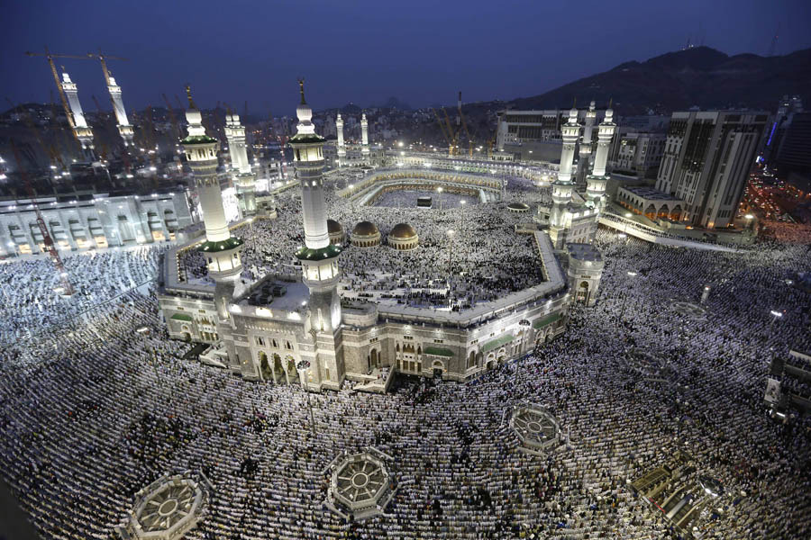Muslim pilgrims circle the Kaaba as pray inside and outside the Grand mosque in Mecca, Saudi Arabia, Monday, Oct. 22, 2012. The annual Islamic pilgrimage draws three million visitors each year, making it the largest yearly gathering of people in the world. (AP Photo/Hassan Ammar)