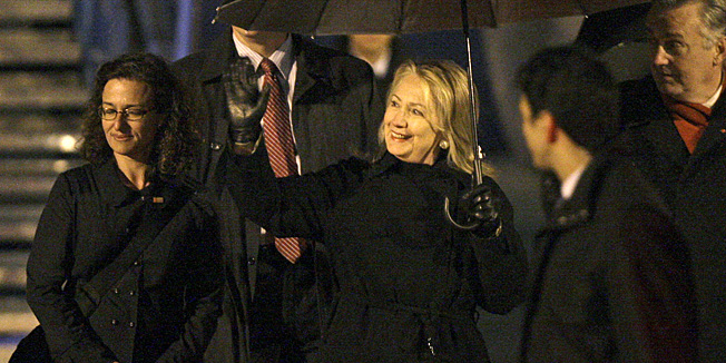 U.S. Secretary of State Hillary Rodham Clinton waves on arrival at Sarajevo Airport, Bosnia Monday, Oct. 29, 2012. Clinton left Algeria for three days of talks in the Balkans, arriving Monday night in the Bosnian capital of Sarajevo. She plans to join the European Union's top diplomat in meetings with the leaders of Bosnia, Serbia and Kosovo, urging those nations to make the necessary reforms to join the EU and NATO. She'll finish with meetings in Croatia and Albania, NATO's two newest members. (AP Photo/Amel Emric)