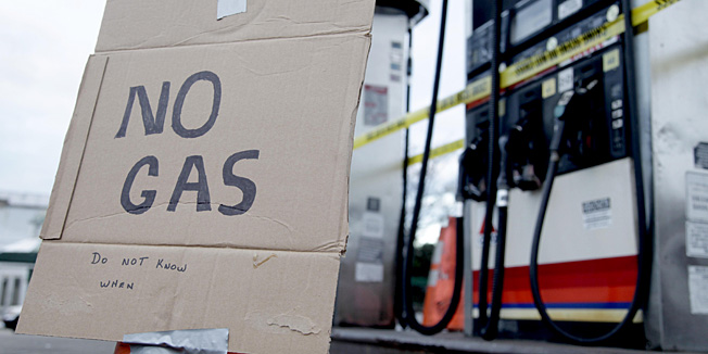 A sign indicates that no gas is available at a gas station in the Brooklyn borough of New York, Friday, Nov. 2, 2012. Homeland Security Secretary Janet Napolitano on Friday temporarily waived a maritime rule to allow foreign oil tankers coming from the Gulf of Mexico to enter Northeastern ports to help ease a fuel shortage in the areas hardest hit by Superstorm Sandy. Area residents have been struggling to find gas stations with power. At stations with power, residents have faced miles-long lines and dwindling supplies. (AP Photo/Seth Wenig)