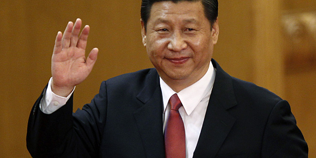 New Communist Party General Secretary Xi Jinping waves in Beijing's Great Hall of the People Thursday, Nov. 15, 2012. Xi became China's new leader Thursday, assuming the top posts in the Communist Party and the powerful military in a political transition unbowed by scandals, a slower economy and public demands for reforms. (AP Photo/Vincent Yu)