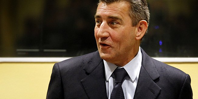 Former Croatian Army General Ante Gotovina enters the courtroom of the Yugoslav war crimes tribunal (ICTY) for his appeal judgement in The Hague, Netherlands, Friday, Nov. 16, 2012. The ICTY is delivering its decision in the appeal of two Croatian generals convicted for their roles in a 1995 military offensive to drive Serb rebels out of land they had occupied for years along part of Croatia's border with Bosnia. Ante Gotovina and Mladen Markac, were sentenced to 24 and 18 years respectively in 2011 for war crimes and crimes against humanity. (AP Photo/Bas Czerwinski, Pool)