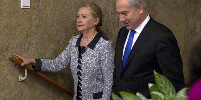 Israel's Prime Minister Benjamin Netanyahu walks with U.S. Secretary of State Hillary Rodham Clinton upon her arrival to their meeting in Jerusalem, Tuesday, Nov. 20, 2012. A diplomatic push to end Israel's nearly weeklong offensive in the Gaza Strip gained momentum Tuesday, with Egypt's president predicting that airstrikes would soon end, the U.S. secretary of state racing to the region and Israel's prime minister saying his country would be a 