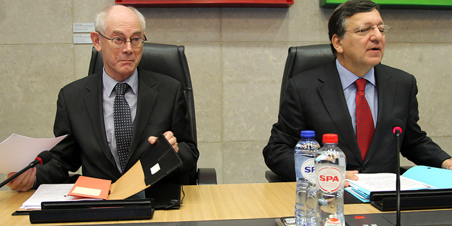 European Council President Herman Van Rompuy, left, sits next to European Commission President Jose Manuel Barroso during a European Commissioners meeting, at the European Commission headquarters in Brussels, Wednesday, Nov. 14, 2012. (AP Photo/Yves Logghe)