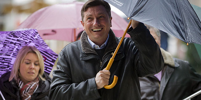 Slovenia's former prime minister Borut Pahor arrives at a polling station in Sempeter, Slovenia, Sunday, Dec. 2, 2012. Small, crisis-hit EU member Slovenia is choosing a president in an atmosphere of uncertainty and growing discontent with cost-cutting measures designed to avoid an international bailout. (AP Photo/Darko Bandic)