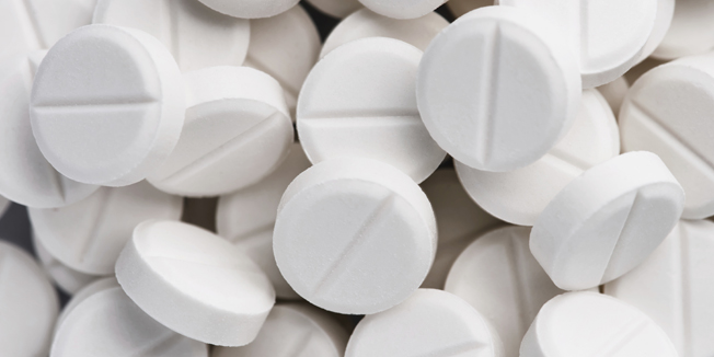 Pharmaceutical research. White pills background