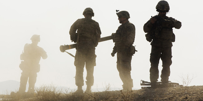 U.S. soldiers from D Troop of the 3rd Cavalry Regiment walk on a hill after finishing with a training exercise near forward operating base Gamberi in the Laghman province of Afghanistan December 30, 2014. REUTERS/Lucas Jackson (AFGHANISTAN - Tags: CIVIL UNREST POLITICS MILITARY TPX IMAGES OF THE DAY) - RTR4JLJC