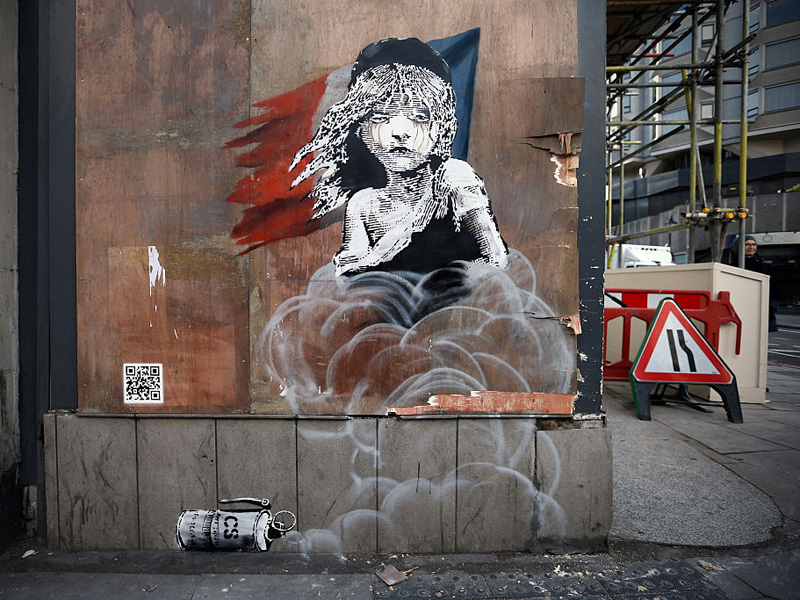 a-new-banksy-appears-protesting-over-the-use-of-teargas-on-migrants-in-calais.bin