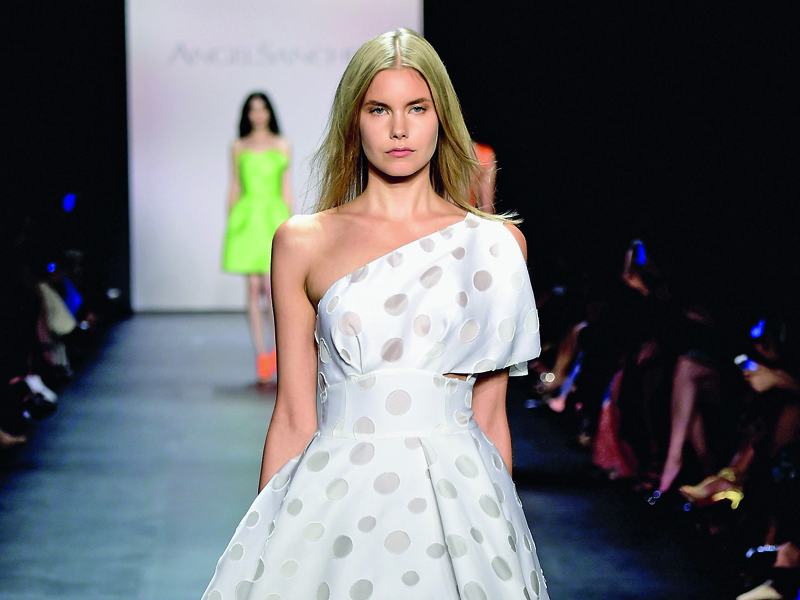 NEW YORK, NY - SEPTEMBER 15:  A model walks the runway wearing Angel Sanchez Spring 2016 during New York Fashion Week: The Shows at The Dock, Skylight at Moynihan Station on September 15, 2015 in New York City.  (Photo by Frazer Harrison/Getty Images for NYFW: The Shows)