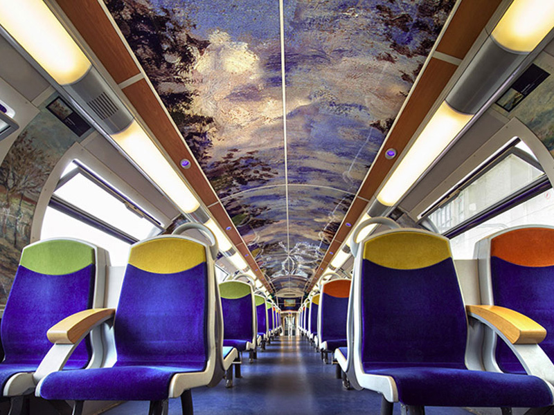 French Trains Are Being Turned Into Moving Art Museums..Instead of encouraging people to visit their world-famous landmarks, FranceĂ•s national state-owned rail service SNCF has come up with a fantastic idea. TheyĂ•ve decided to bring these landmarks to you, and you can enjoy them at your leisure during your morning commute to work..Working in collaboration with American manufacturing company 3M, the SNCF has been giving trains a series of artistic makeovers. They cover the interiors with graphic film that contains various famous works of art for passengers to peruse. Designs include flowers and furnishings from the Palace of Versailles, impressionist art from the MusĹ˝e dĂ•Orsay and images from CinĹ˝ma Gaumont, the oldest film company in the world..Not only has the series, titled Art In Transit, helped to make life more interesting for passengers; itĂ•s also apparently helped to deter vandals from damaging the trains. .Â©Exclusivepix Media, Image: 286495327, License: Rights-managed, Restrictions: * France, Germany, Italy and United Kingdom Rights OUT *, Model Release: no, Credit line: Profimedia, Zuma Press - News