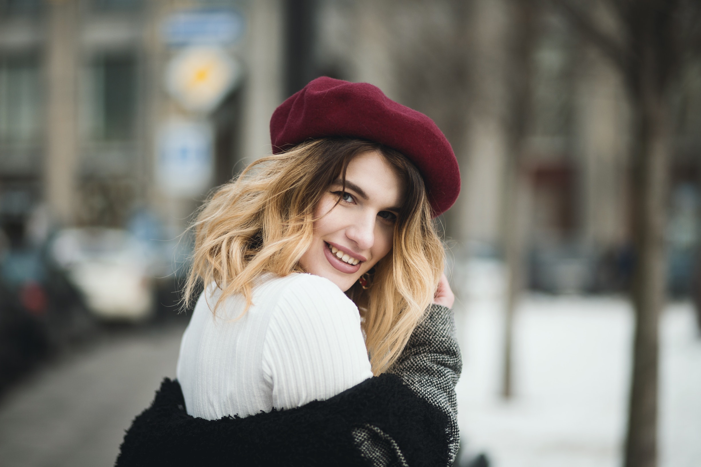 selective-focus-photography-of-smiling-woman-wearing-red-hat-1381558