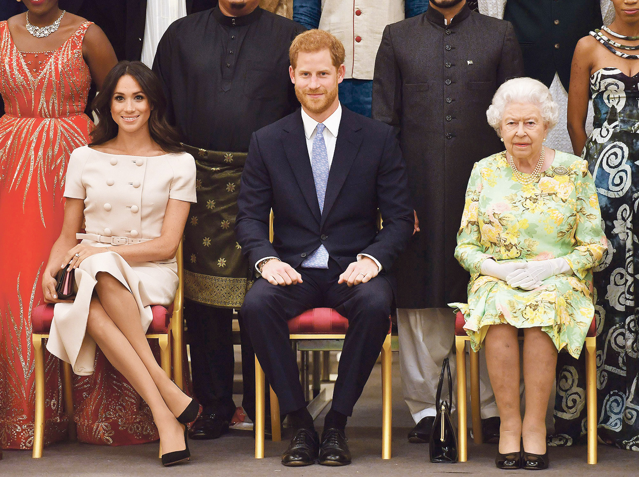 Meghan Markle, princ Harry i Elizabeta II.
