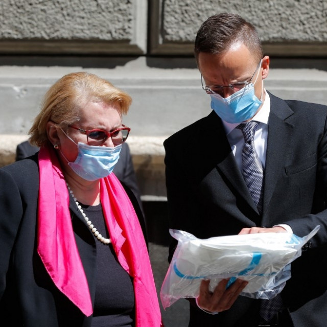 Hungarian Minister of Foreign Affairs and Trade Peter Szijjarto (R) delivers medical equipment aid to Bosnian Foreign Minister Bisera Turkovic (L) within the coronavirus (Covid-19) precautions in Sarajevo, Bosnia and Herzegovina on April 16,