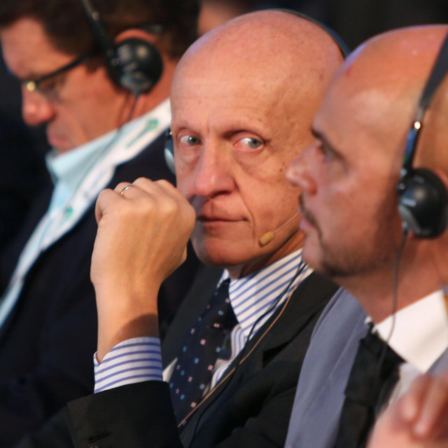 Italian former football referee Pierluigi Collina (C) attends the first session of the eighth Dubai International Sports Conference on December 28, 2013 in Dubai. AFP PHOTO/MARWAN NAAMANI