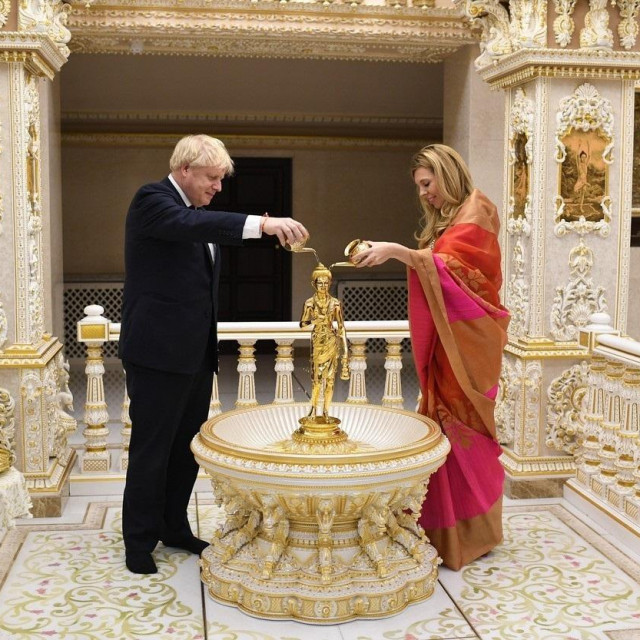 December 7, 2019, Heald Green, Cheshire, United Kingdom: Image Â©Licensed to i-Images Picture Agency. 07/12/2019. Heald Green,, United Kingdom. Boris Johnson General Election Campaign Day 28. Britain's Prime Minister Boris Johnson and his partner Carrie Symonds visit Neasden Temple on day 28 of the General election campaign.,Image: 486961496, License: Rights-managed, Restrictions: * China, France, Italy, Spain, Taiwan and UK Rights OUT *, Model Release: no, Credit line: Andrew Parsons/Zuma Press/Profimedia