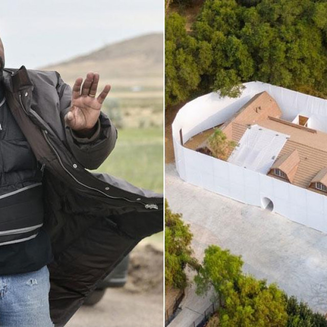 Visoki bijeli zid oko reperove kuće