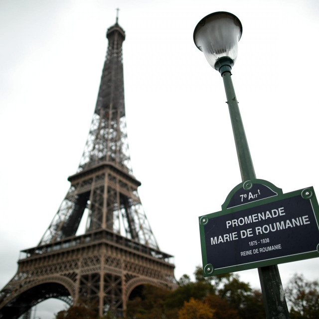 This picture taken on October 27, 2020, shows the sign of the Promenade Marie de Roumanie in front of the Eiffel Tower in Paris. (Photo by BENOIT TESSIER/POOL/AFP)