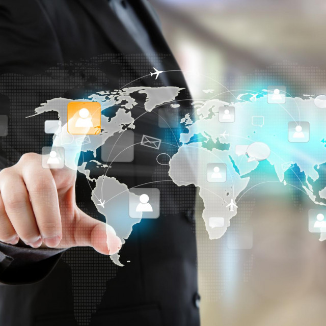 Social Network concept: Business man point to social network and world map