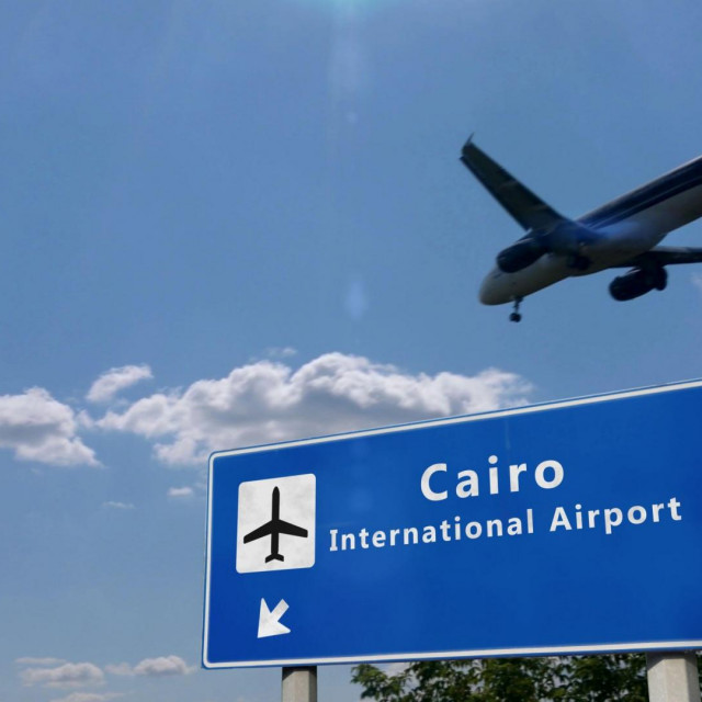 Airplane silhouette landing in Cairo, Egypt. City arrival with airport direction signboard and sunset in background. Trip and transportation concept 3d illustration.,Image: 508169697, License: Royalty-free, Restrictions:, Model Release: no, Credit line: Skorzewiak/Alamy/Alamy/Profimedia