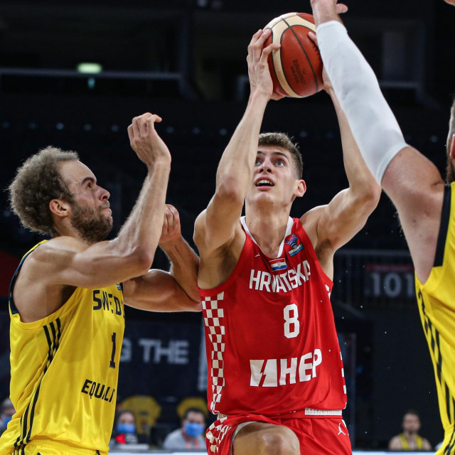 ​​​​​​​​​​​​​​​​​​​​​​​​​​​​ISTANBUL, TURKEY - NOVEMBER 29: Roko Prkacin (8) of Croatia in action against Adam Ramstedt (2) of Sweden during EuroBasket 2022 qualifiers men's national basketball match between Sweden and Croatia at Sinan Erdem Sports Hall in Istanbul, Turkey on November 29, 2020. Elif Ozturk/Anadolu Agency